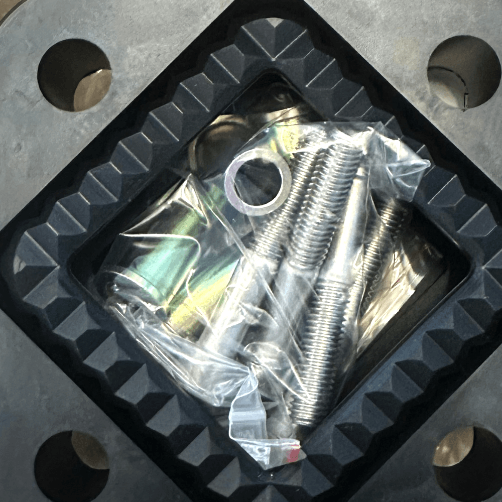 Underside of the cover showing the recess for the unit and its mounting screw kit
