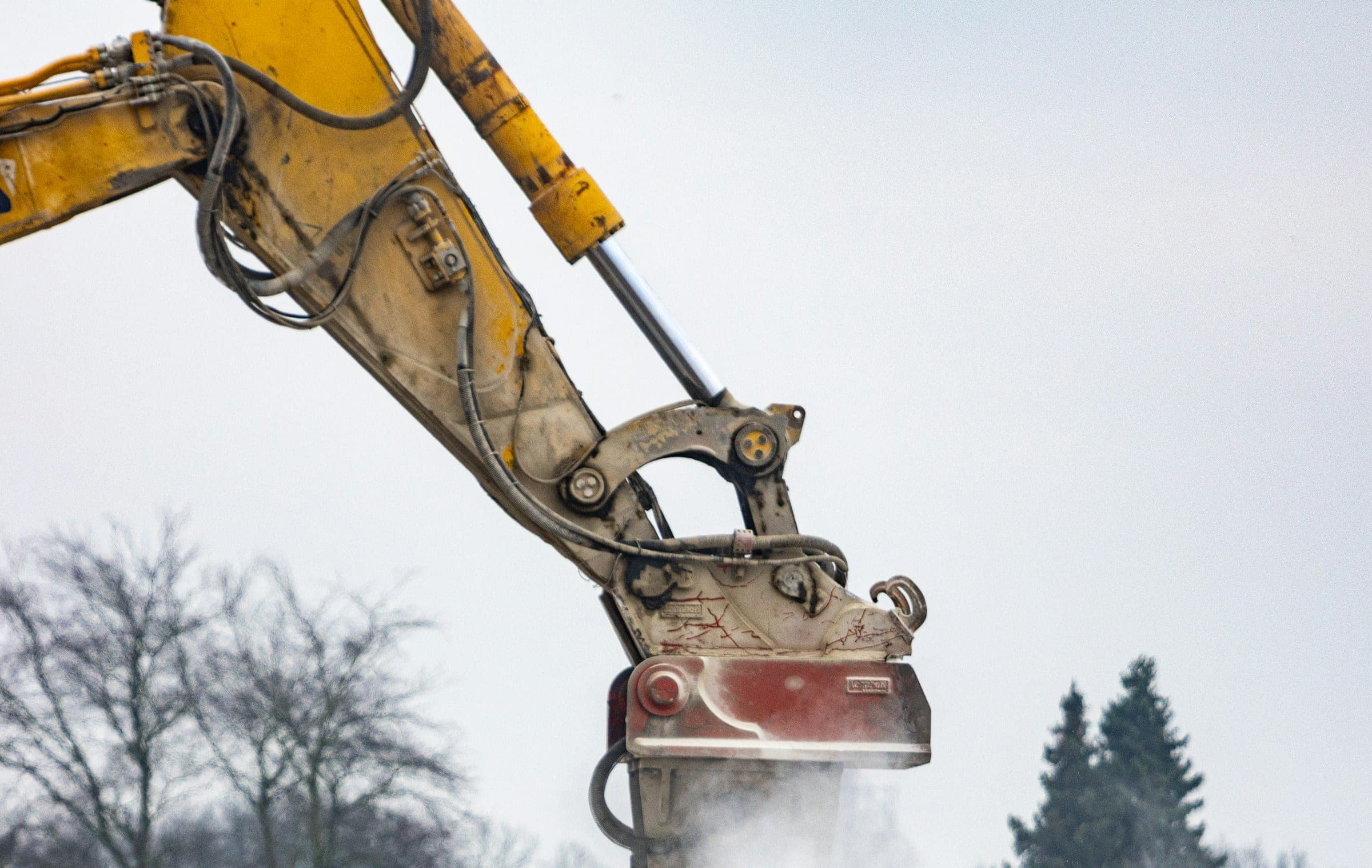Hydraulic breaker on a rugged construction site