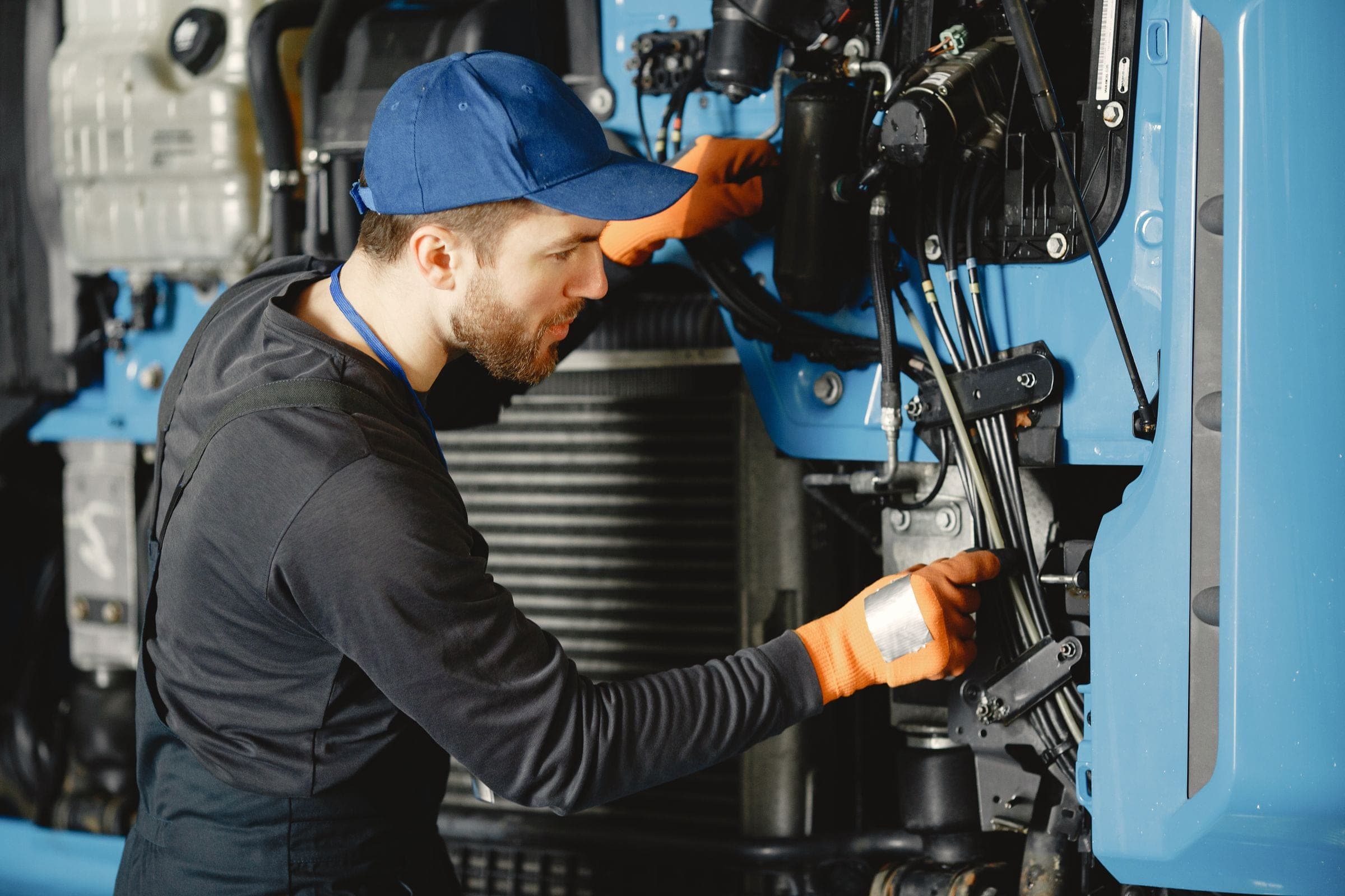 Technician inspecting machinery