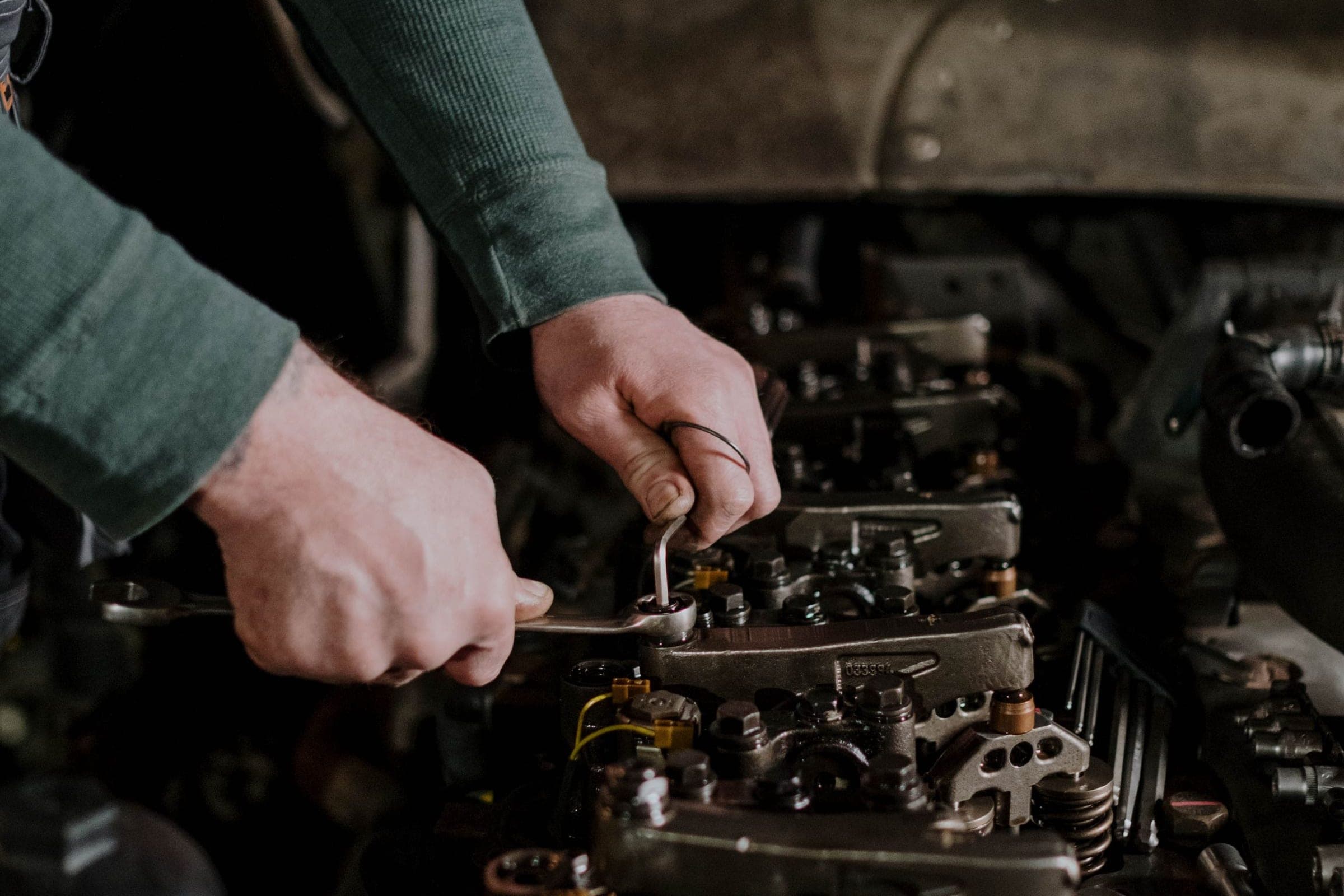 Mechanic using diagnostic tools on site
