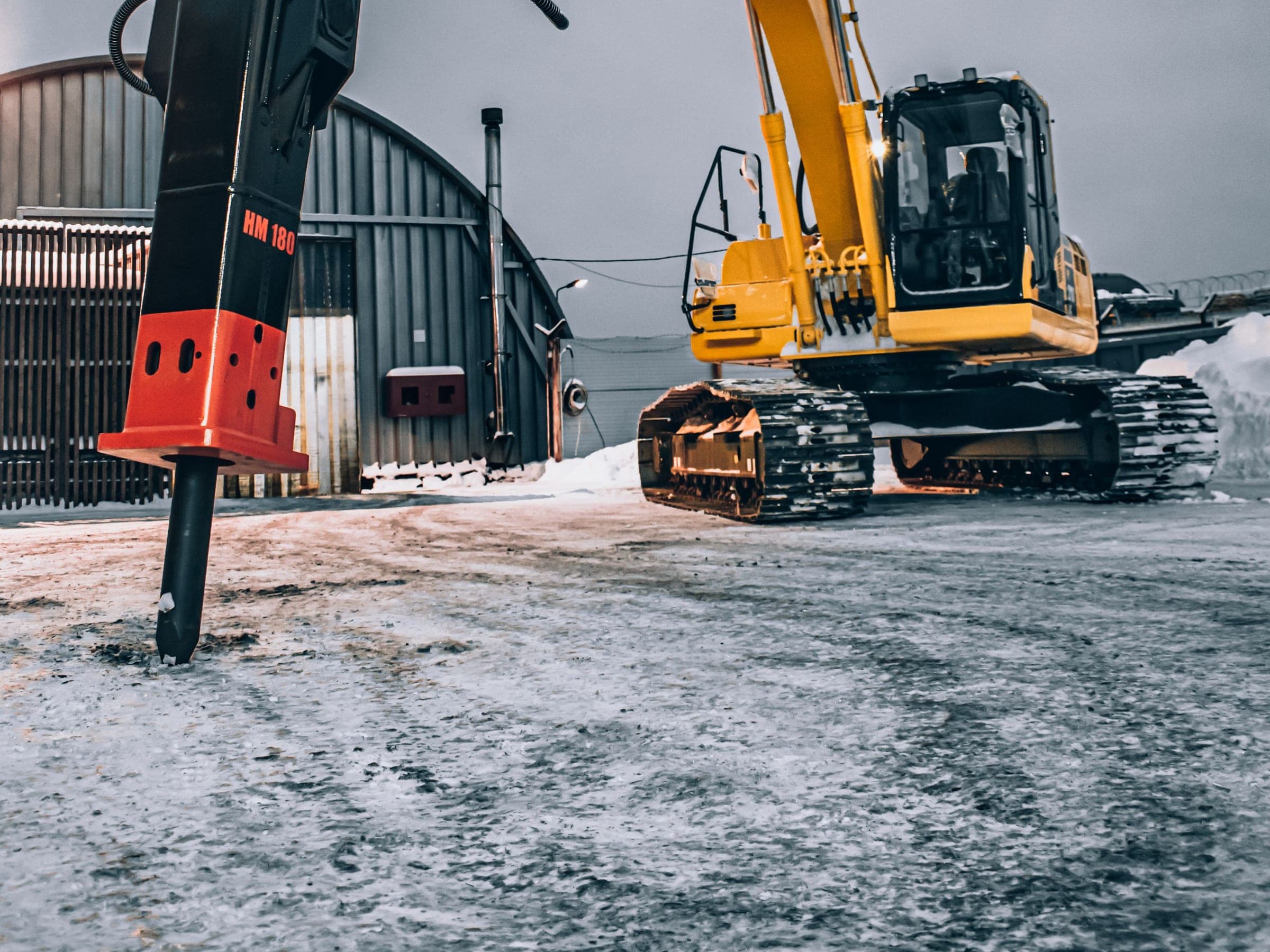 Hydraulic breaker attachment on site