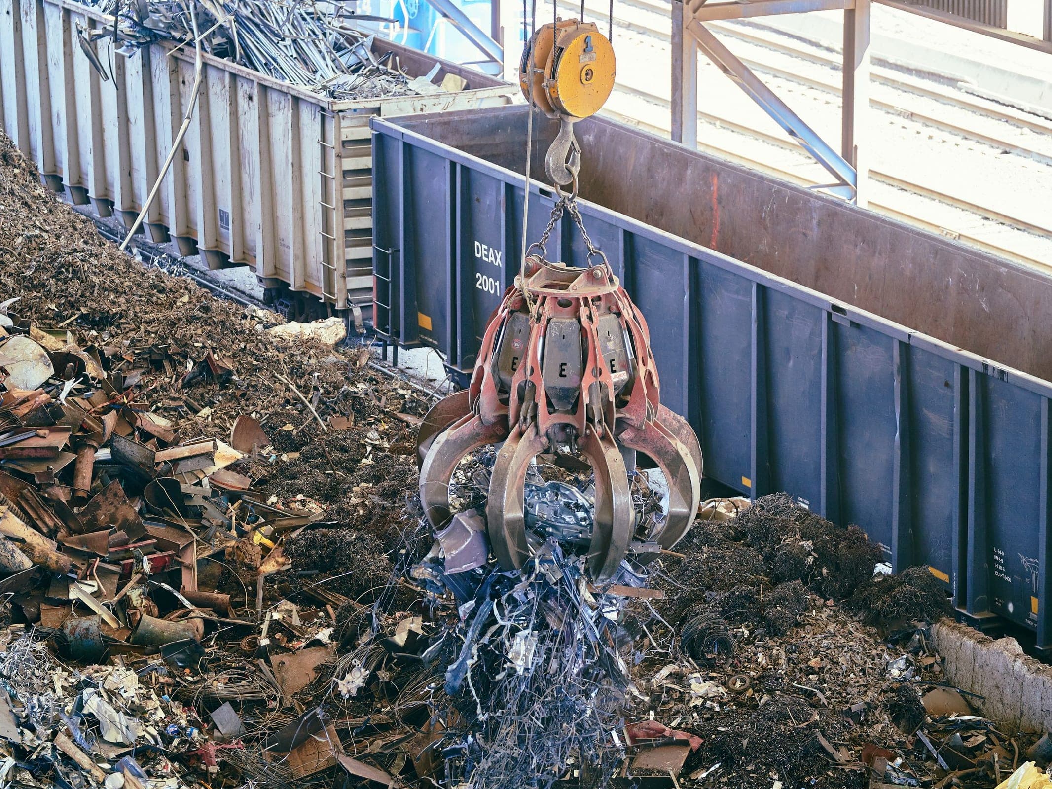 Excavator grapple attachment at work